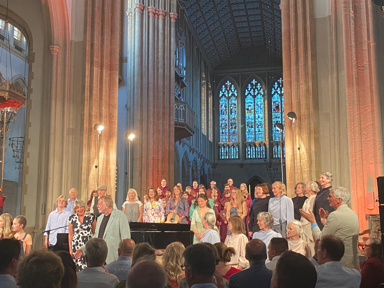 A group of people performing inside a cathedral