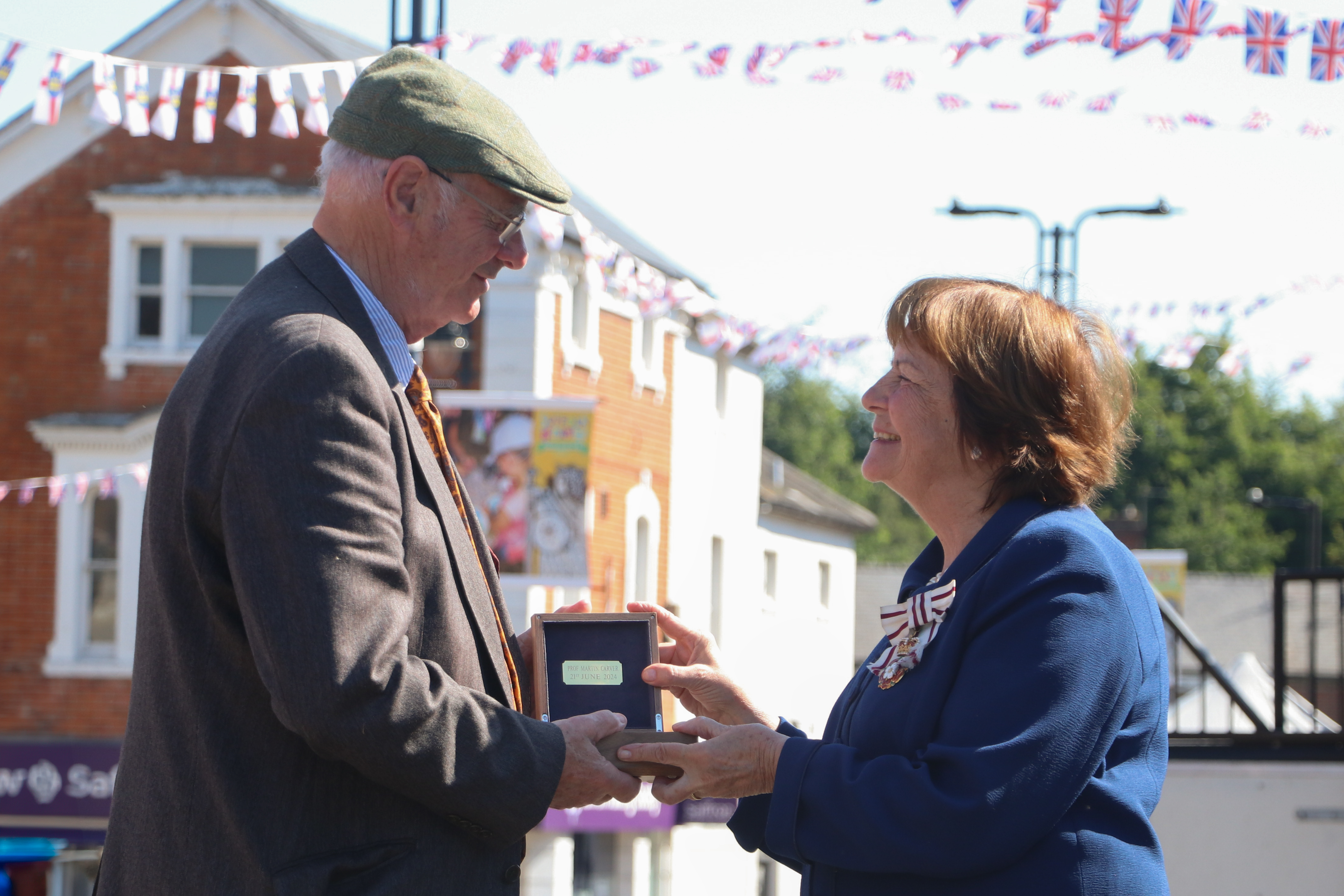 Professor Martin Carver receiving a Suffolk Medal from Clare, Countess of Euston